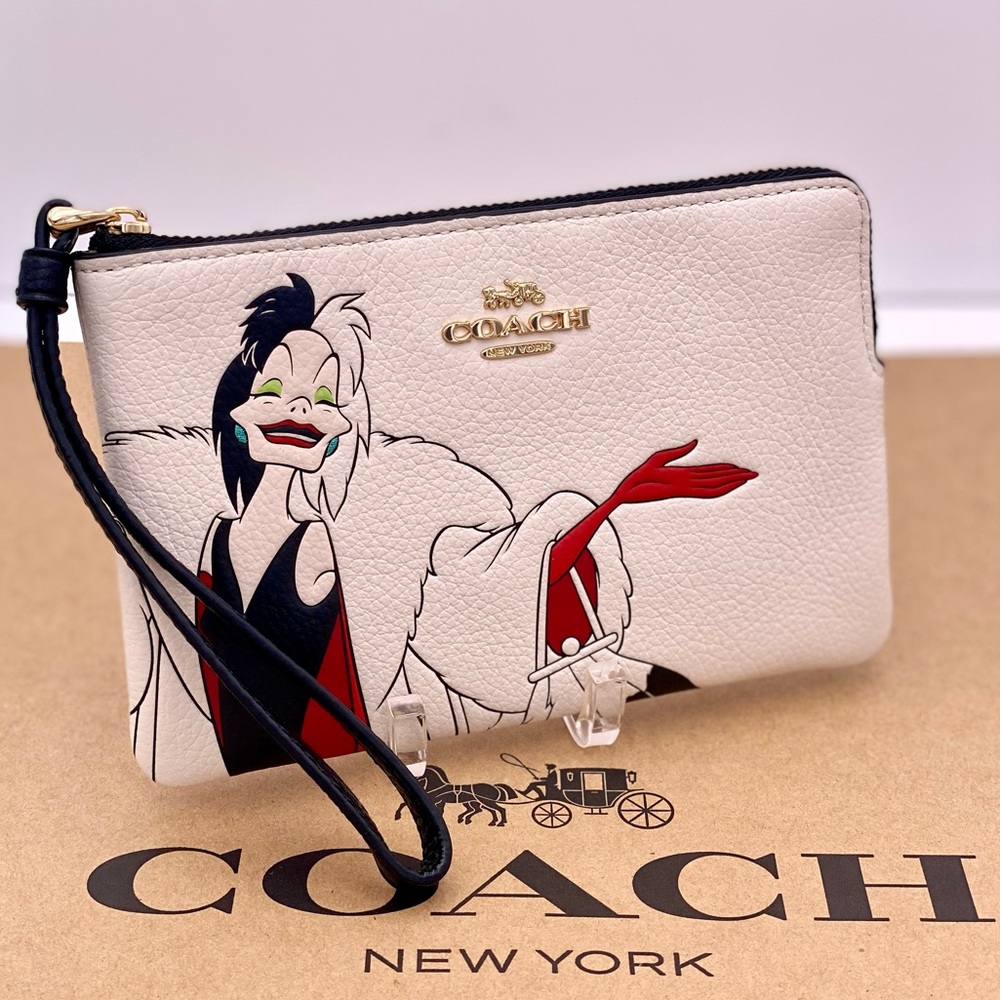 Disney X Coach Corner Zip Wristlet Wallet 
With Cruella Motif